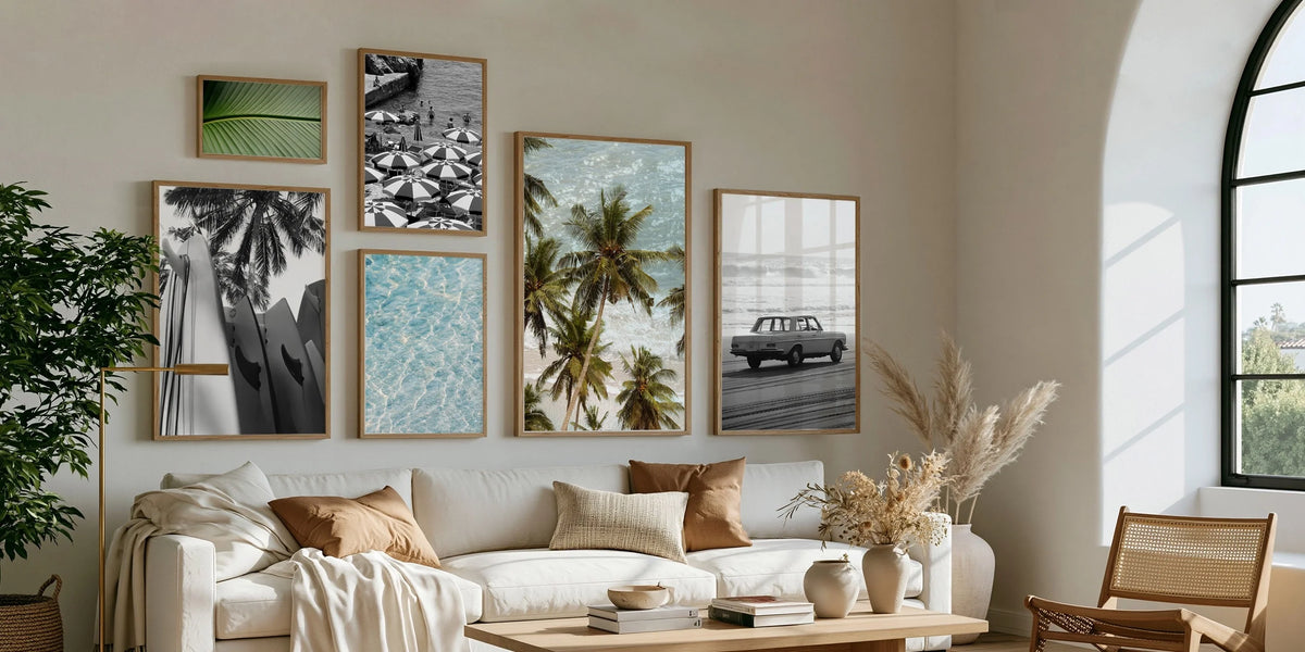 Cozy minimalist living room with warm neutral tones, natural textures, and large coastal photography as wall art focal point